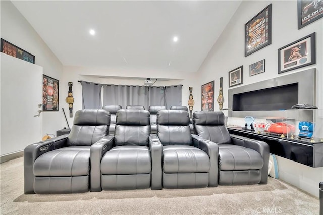 carpeted cinema featuring high vaulted ceiling and recessed lighting