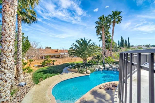 view of swimming pool with fence and a fenced in pool