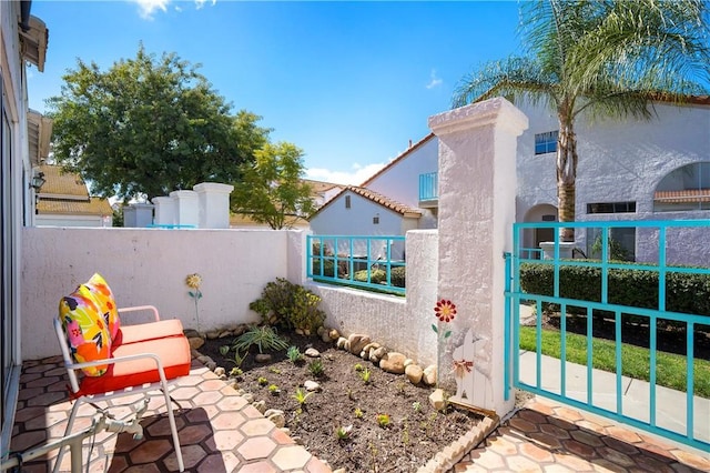 view of patio / terrace with a gate and fence