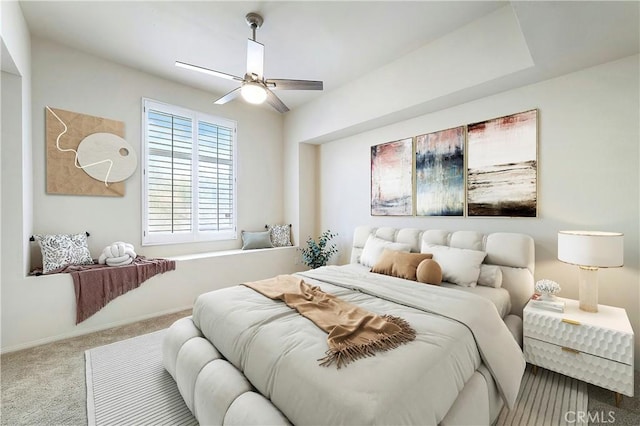 bedroom with carpet, a ceiling fan, and baseboards