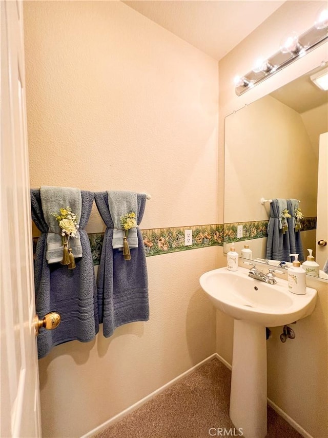 bathroom featuring baseboards