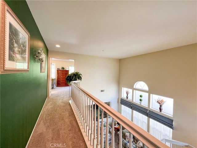 corridor with recessed lighting, carpet, visible vents, and a healthy amount of sunlight