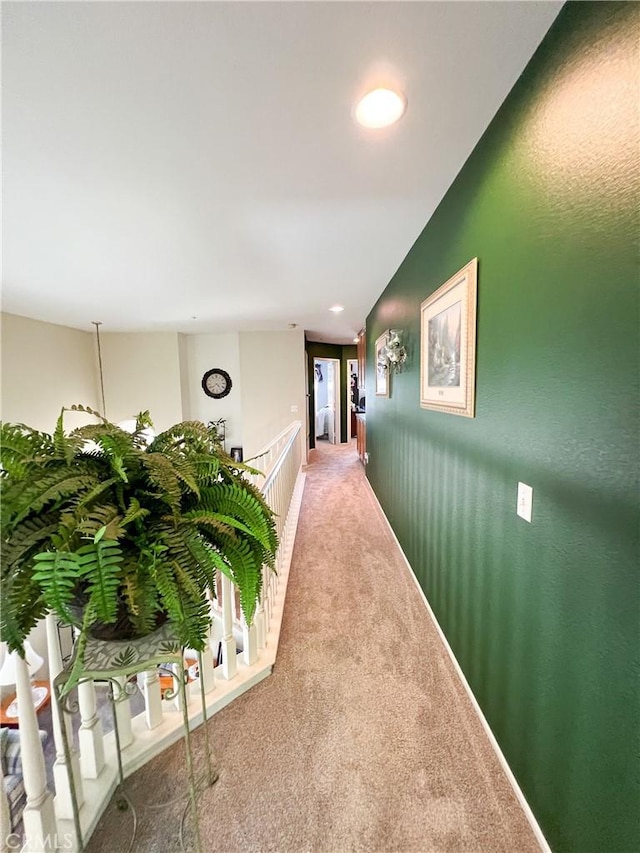 corridor with recessed lighting, an upstairs landing, lofted ceiling, and carpet flooring