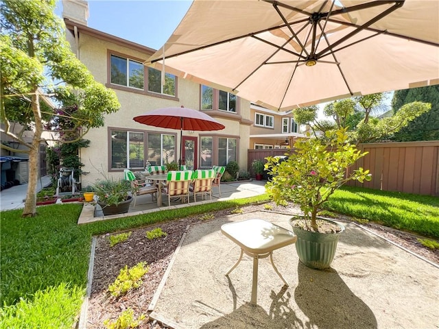 view of patio / terrace featuring fence