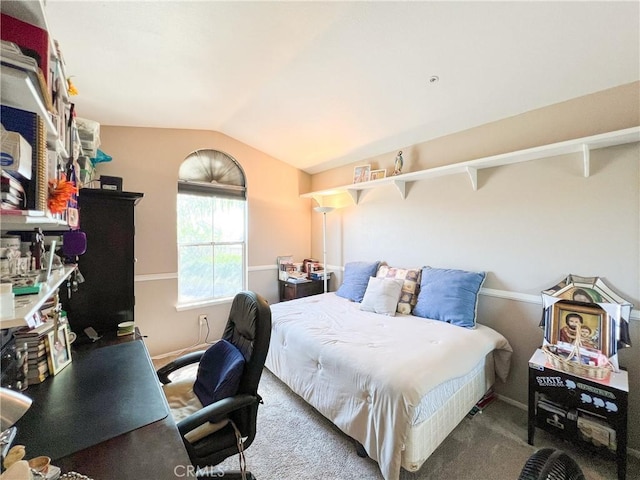 carpeted bedroom featuring lofted ceiling