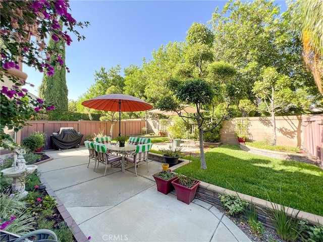 view of patio / terrace featuring outdoor dining space and a fenced backyard