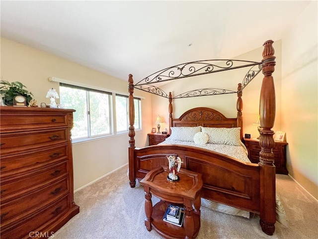 bedroom with baseboards and carpet floors