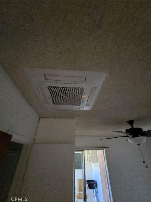 interior details with visible vents and a ceiling fan