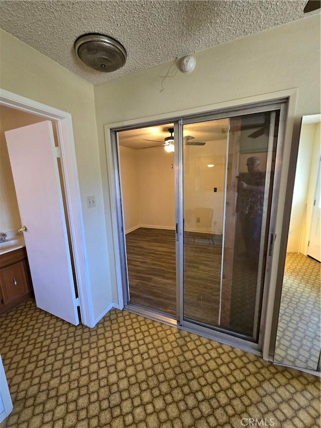 interior space featuring a textured ceiling