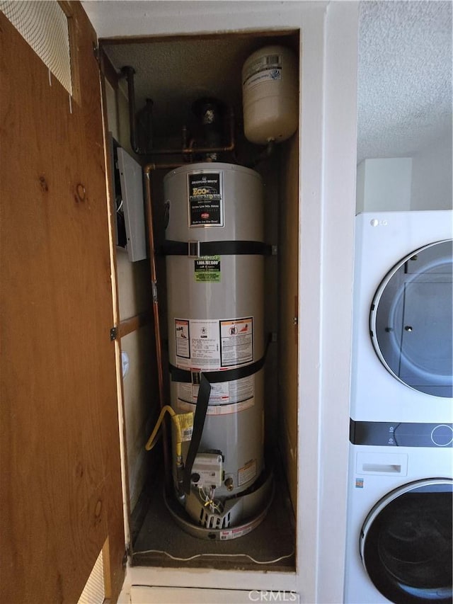 utilities with stacked washer and clothes dryer and secured water heater