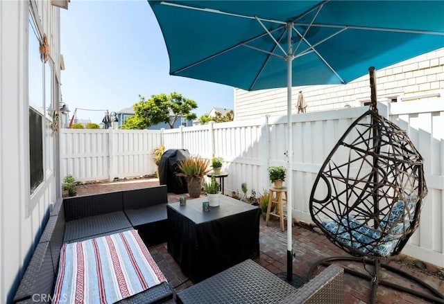 view of patio with a fenced backyard, grilling area, and an outdoor hangout area