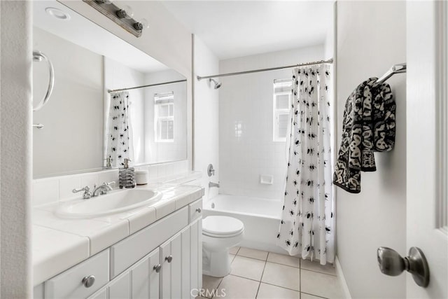 bathroom featuring toilet, tile patterned flooring, shower / tub combo with curtain, and vanity