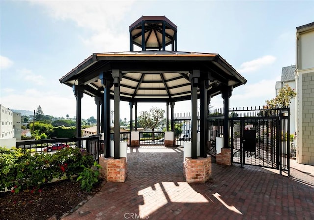 view of community with fence and a gazebo