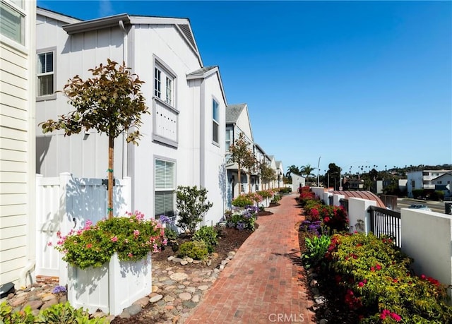 view of home's community featuring a residential view and fence