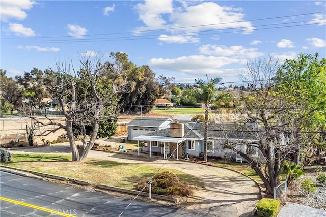 view of front of home with a front yard and a chimney