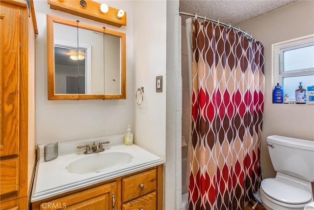 bathroom featuring toilet, a shower with shower curtain, a textured ceiling, and vanity