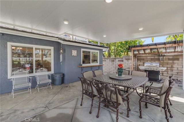 view of patio / terrace with outdoor dining space and a grill