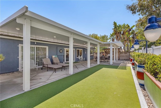 exterior space featuring a patio and fence