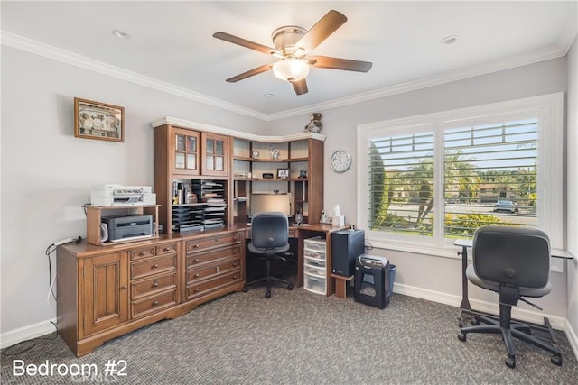 carpeted office with baseboards, a ceiling fan, and crown molding