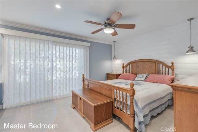 bedroom featuring a ceiling fan and crown molding