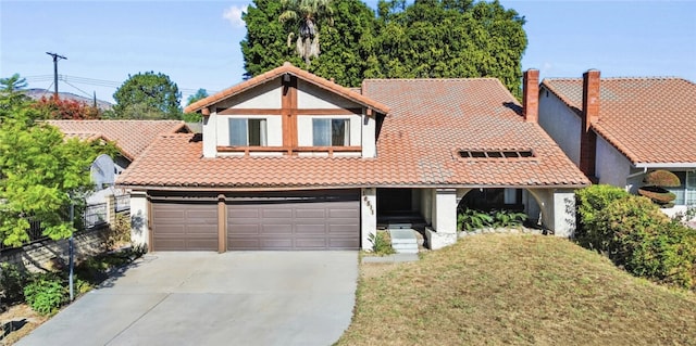 view of front facade featuring fence, a tiled roof, concrete driveway, stucco siding, and a front lawn