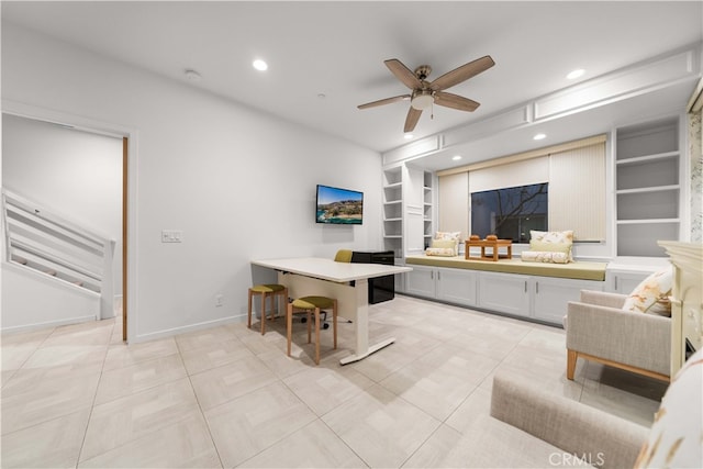 living area with light tile patterned floors, baseboards, ceiling fan, built in shelves, and recessed lighting