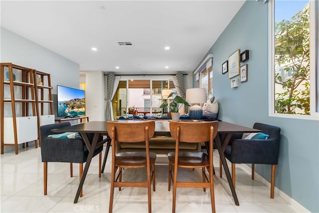 dining area with recessed lighting, visible vents, and plenty of natural light