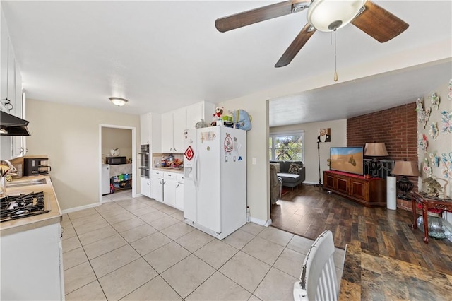 kitchen featuring light tile patterned floors, white refrigerator with ice dispenser, white cabinets, light countertops, and black microwave