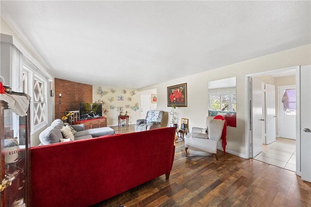 living room featuring wood finished floors and baseboards