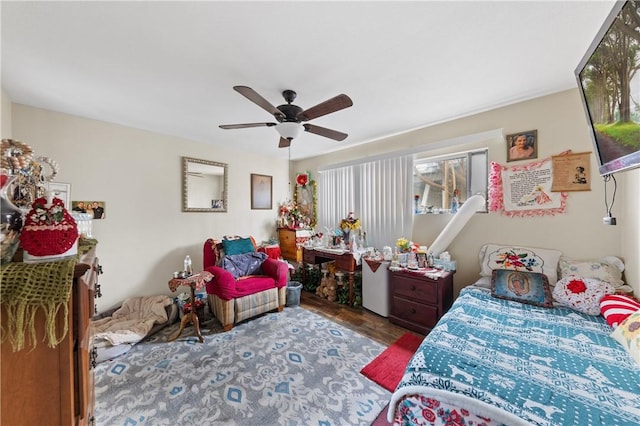 bedroom with wood finished floors and a ceiling fan