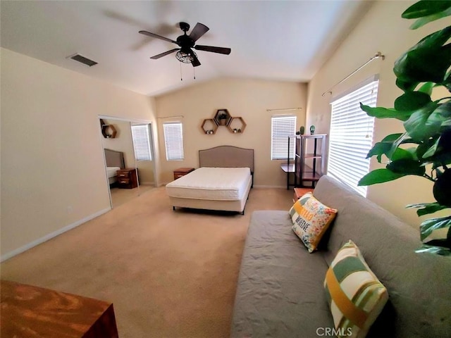 bedroom with baseboards, visible vents, a ceiling fan, carpet, and vaulted ceiling