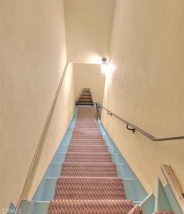 stairs featuring tile patterned floors