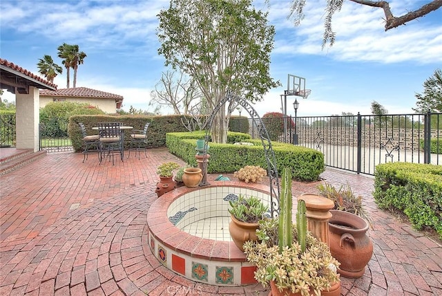 view of patio / terrace featuring outdoor dining area and fence