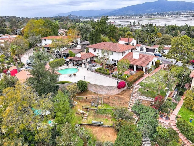 birds eye view of property with a mountain view