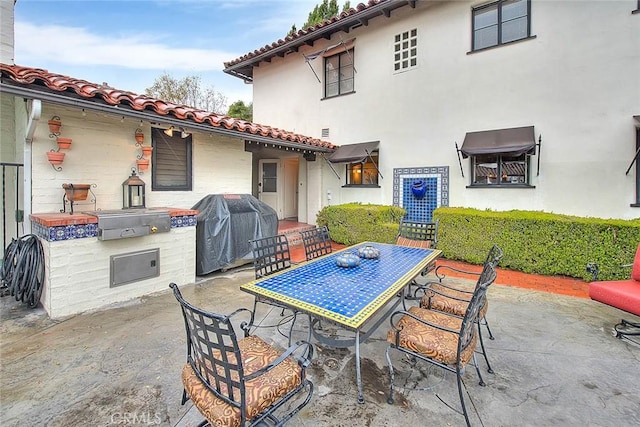 view of patio / terrace with grilling area and outdoor dining space