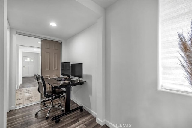 office area featuring baseboards and wood finished floors