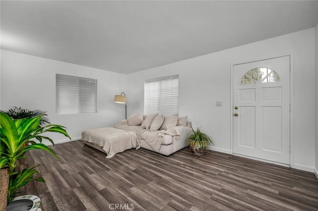 interior space featuring wood finished floors and baseboards