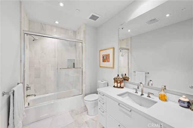bathroom featuring visible vents, bath / shower combo with glass door, vanity, and toilet