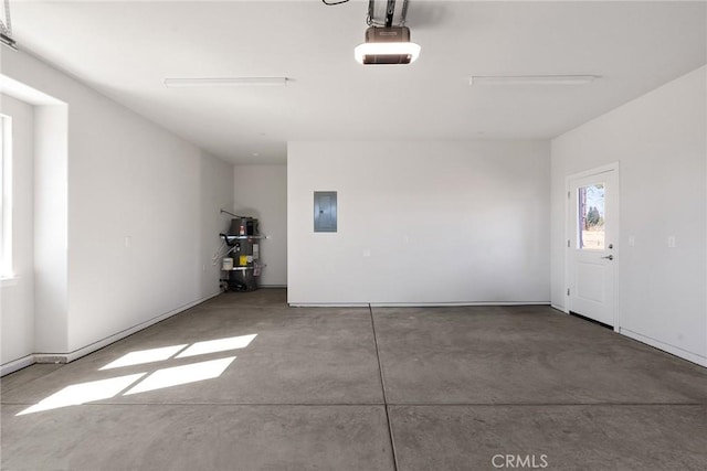 garage with water heater, electric panel, and a garage door opener