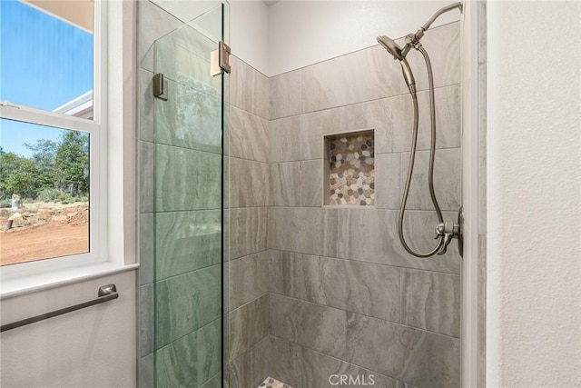 full bathroom with tiled shower