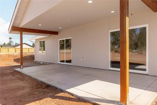 view of patio / terrace featuring fence