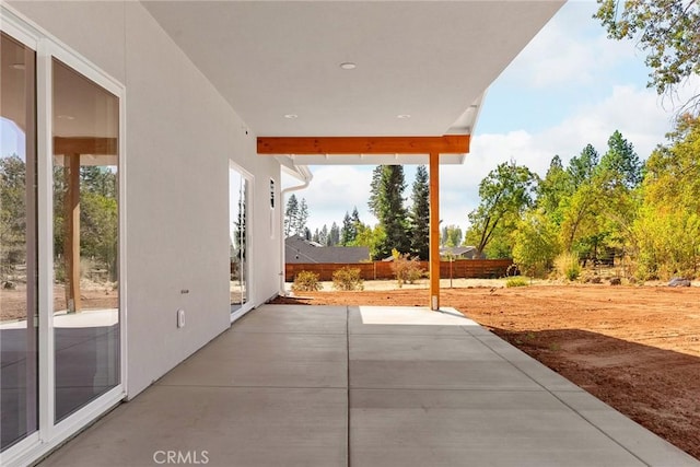 view of patio / terrace featuring fence