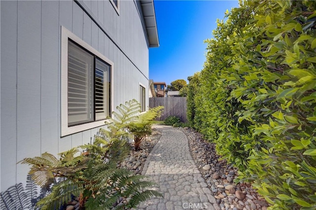 view of home's exterior featuring fence