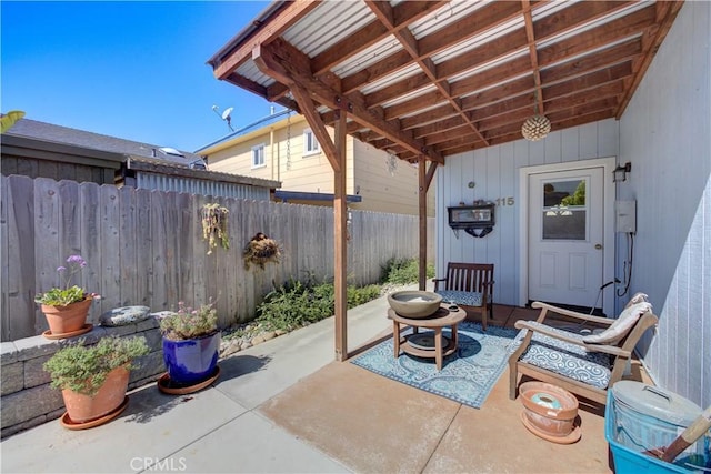 view of patio / terrace featuring fence