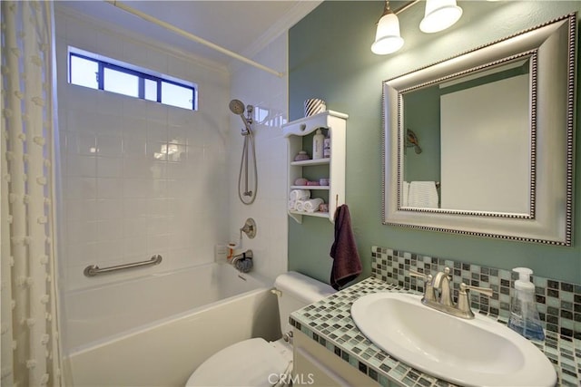 full bath featuring tasteful backsplash, crown molding, toilet, shower / bath combo, and vanity