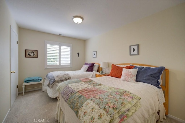 bedroom featuring visible vents, baseboards, and carpet flooring