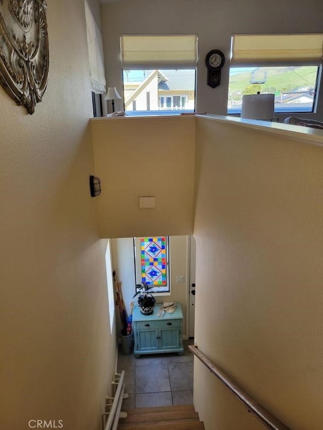 stairway featuring tile patterned floors