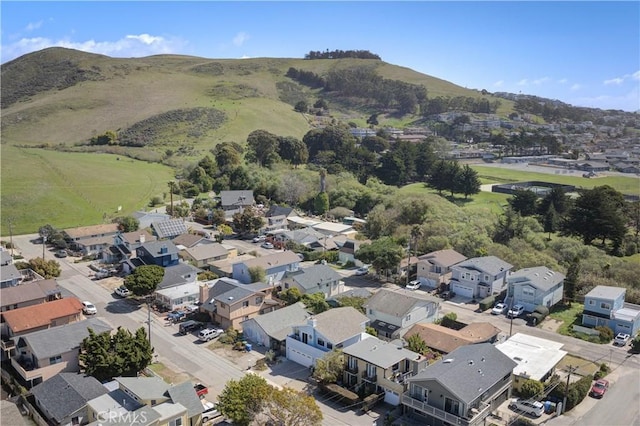 birds eye view of property with a mountain view and a residential view