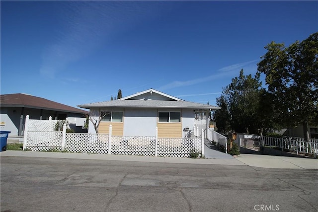 view of front of house with fence