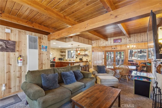 living room with beam ceiling, wood ceiling, and wooden walls